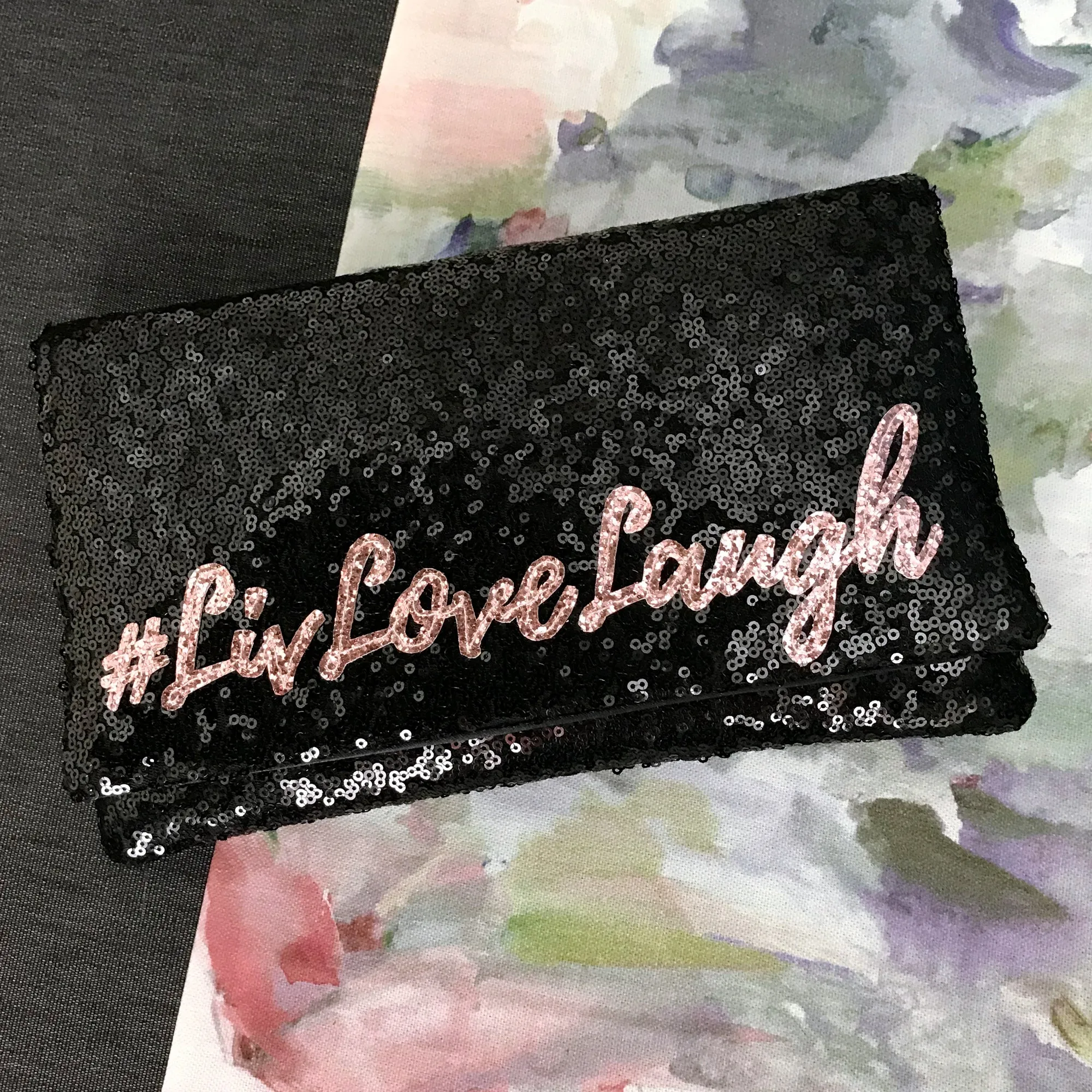 Black or navy SLOGAN sequin clutch handbag